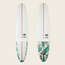 Two white longboards are shown upright against a light background. The lower third of each board features a tropical leaf pattern in green and blue tones, while a brown stripe runs down the center, highlighting their versatile handling.