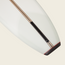 Close-up of the tail end of a traditional surfboard, featuring wood stringer details and a black fin box—this classic design is ideal for noseriding, inspired by the iconic Bing Noserider style.