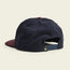 A corduroy Unstructured Snapback cap viewed from the back, featuring a navy blue soft crown, maroon button on top, and maroon brim. The black adjustable snapback closure includes a small logo tag attached.