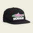 A black cap featuring a colorful fish graphic with green and pink accents above the word HOWLER in bold white letters on the front. This soft crown design includes an adjustable strapback closure for a comfortable fit.