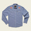 Light blue long-sleeve button-up shirt crafted from stretch chambray, featuring two chest pockets and pearl snaps. Red and white vintage inspired motif embroidery decorates each shoulder near the collar.