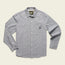 A long-sleeve, button-up light gray Tallier Work Shirt in cotton chambray with two chest pockets and white buttons, laid flat on a light background. A small rectangular tag is visible on the left pocket—classic American workwear style.