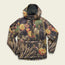A quilted hooded pullover with PrimaLoft insulation, featuring a vibrant cactus and flower print in green, yellow, and orange. This lightweight travel jacket has a front zip, a large front pocket, and a black rectangular logo patch on the chest.