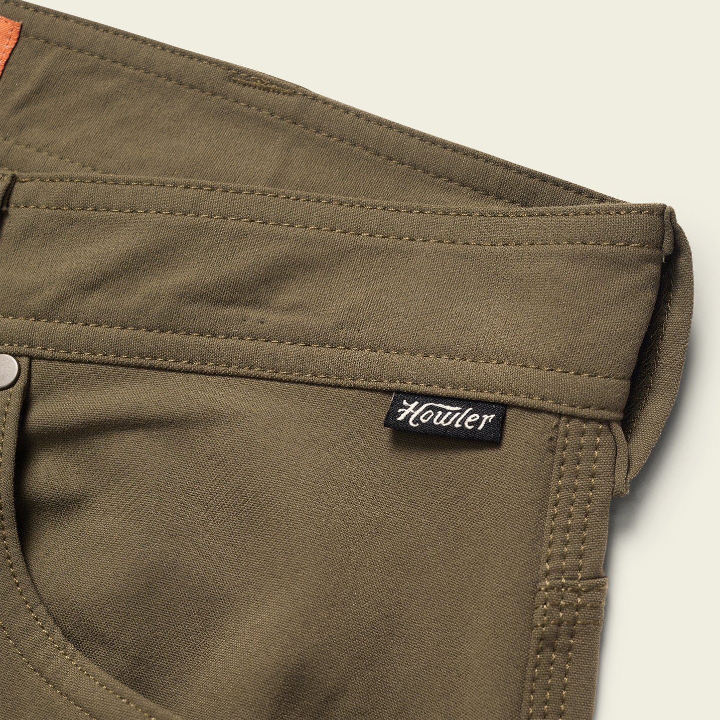 olive green performance tech pants with a classic 5-pocket design