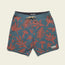 Blue-green Bruja Boardshorts with a drawstring waist and red tropical leaf and nature print, featuring draining front pockets and a small white Head & Colt patch near the hem on the left leg.