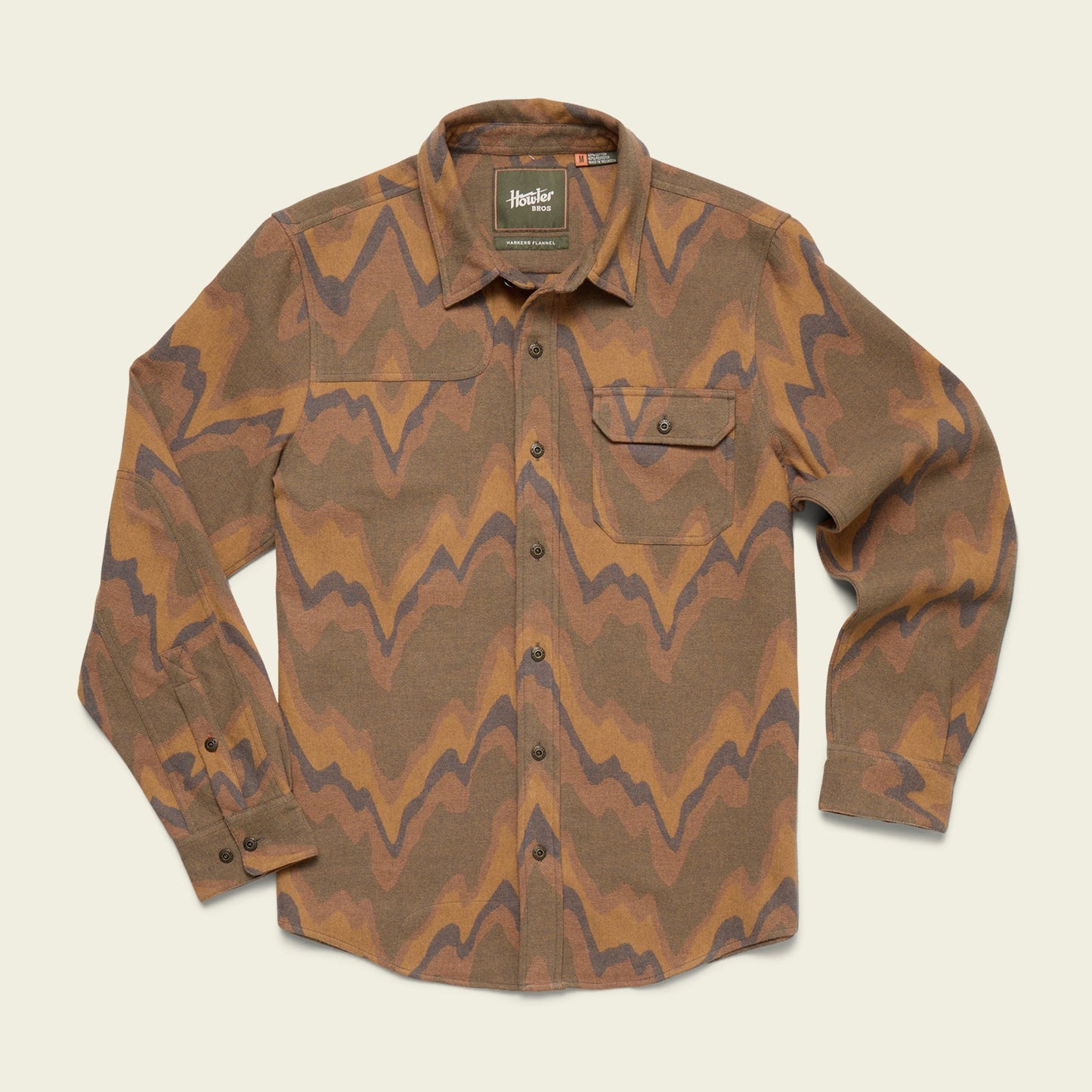 A long-sleeve button-up Harkers Flannel shirt with a brown, tan, and dark wavy zigzag pattern, featuring reinforced elbow patches and a left chest pocket with a flap and button, displayed on a light background.