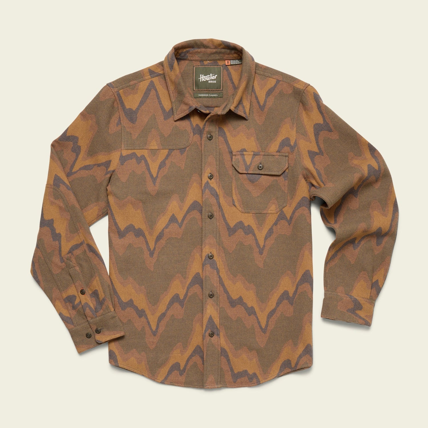 A long-sleeve button-up Harkers Flannel shirt with a brown, tan, and dark wavy zigzag pattern, featuring reinforced elbow patches and a left chest pocket with a flap and button, displayed on a light background.