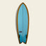 A blue Almond Surfboards surfboard with a brown border and a swallowtail design, displayed vertically against a plain, light background. The board features two black fins and an Almond brand logo near the bottom.