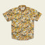 The Mansfield Shirt is a lightweight cotton-poly shirt featuring unique seasonal patterns—a bold, abstract tropical leaf design in orange, yellow, white, and green on a light background.