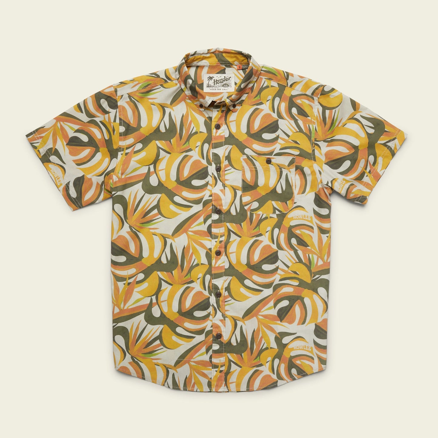 The Mansfield Shirt is a lightweight cotton-poly shirt featuring unique seasonal patterns—a bold, abstract tropical leaf design in orange, yellow, white, and green on a light background.