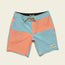 A pair of quick-drying boardshorts with light blue and coral color-blocked panels, a tan drawstring, and a small Howler patch on the lower left leg, displayed on a plain off-white background.