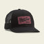 A black mesh trucker hat with a maroon patch on the front displays Howler Bros in script and block letters. Featuring a glare-cutting brim, this adjustable snapback hat is shown on a light background.