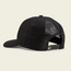 A black mesh trucker hat shown from the back, featuring an adjustable snapback closure and a small green tag near the opening. The hat is displayed on a plain, light-colored background.
