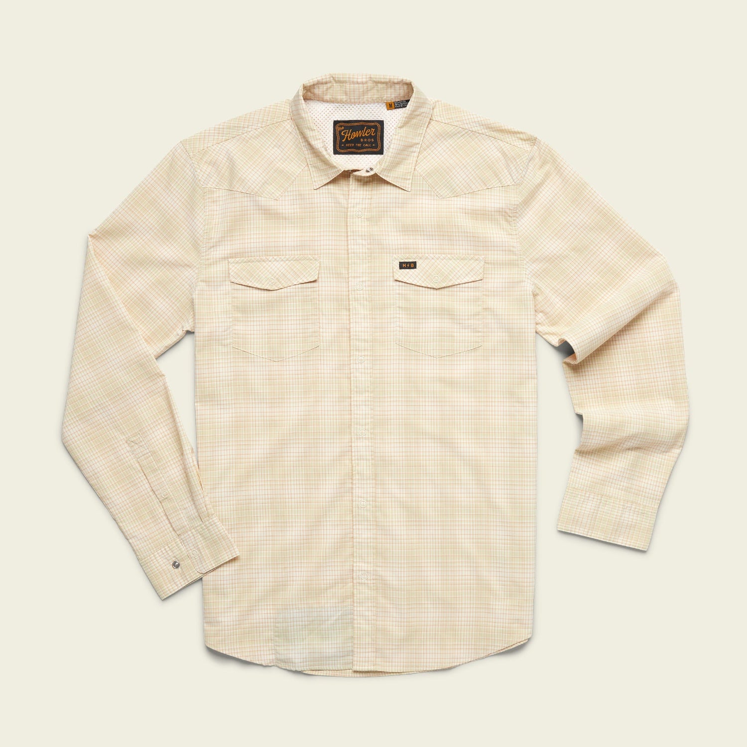 A long-sleeve, light beige plaid lightweight stretch shirt with two chest pockets, a collar, and vented yoke detail, laid flat on a plain off-white background.