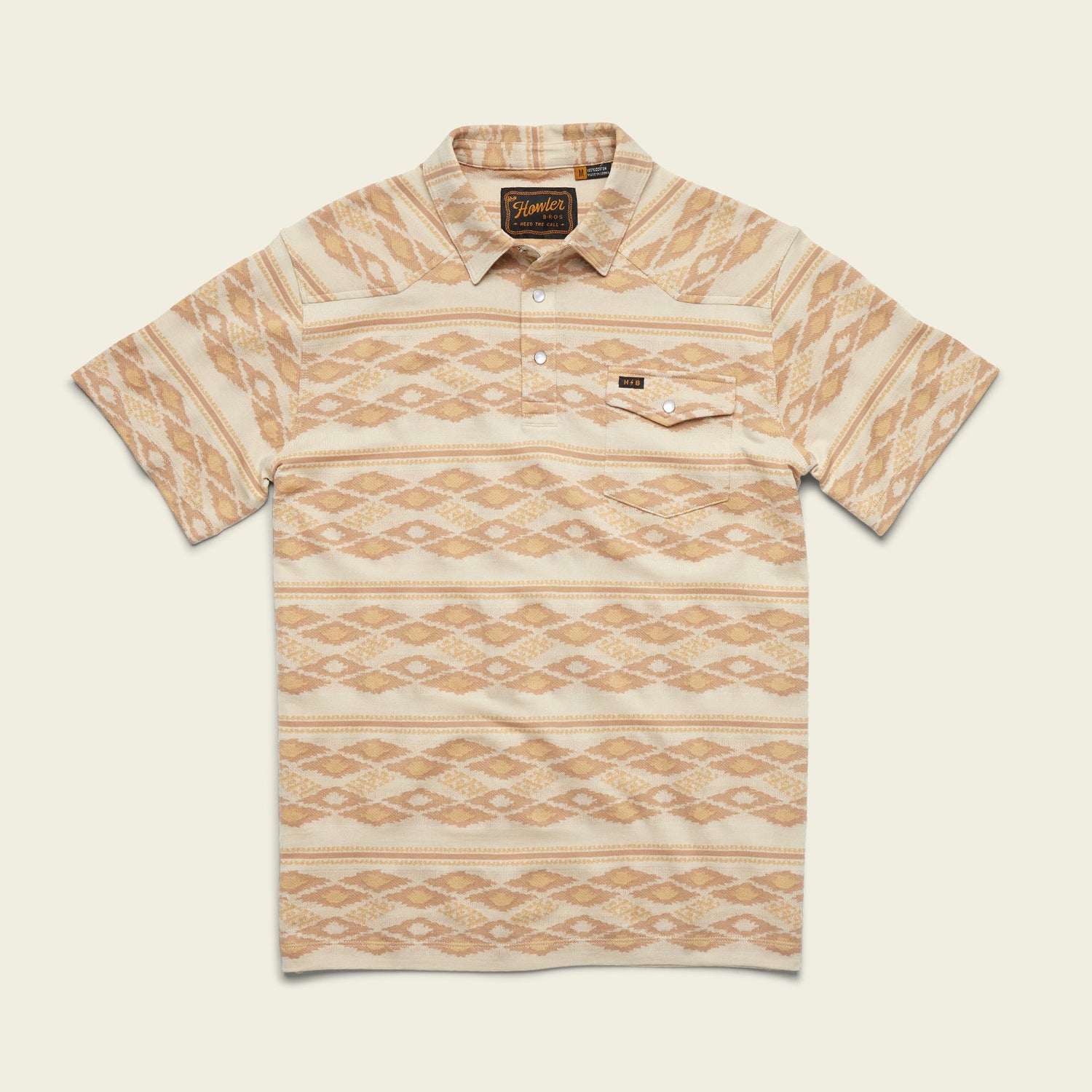 Short-sleeve collared Ranchero Jacquard Polo with a beige and light brown geometric diamond pattern, buttoned placket, and single chest pocket, crafted from 100% cotton jacquard, displayed on a light background.