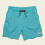Bright turquoise quick drying nylon shorts with an elastic waistband, black and orange drawstring, side pockets, and a small rectangular brand patch on the lower left leg. The background is a pale beige color.