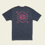 A dark gray Howler blended t-shirt lies flat, showing the back. Made from a cotton-poly blend for maximum comfort, it features bright pink text—Have a Wondere Day—circling icons like a globe, sun, and paisley designs.