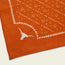 Burnt orange Los Longhorns de Tejas Bandana featuring a white outline of a longhorn steer head and edge details—ideal game day accessory for University of Texas Longhorns fans, set against a light background.
