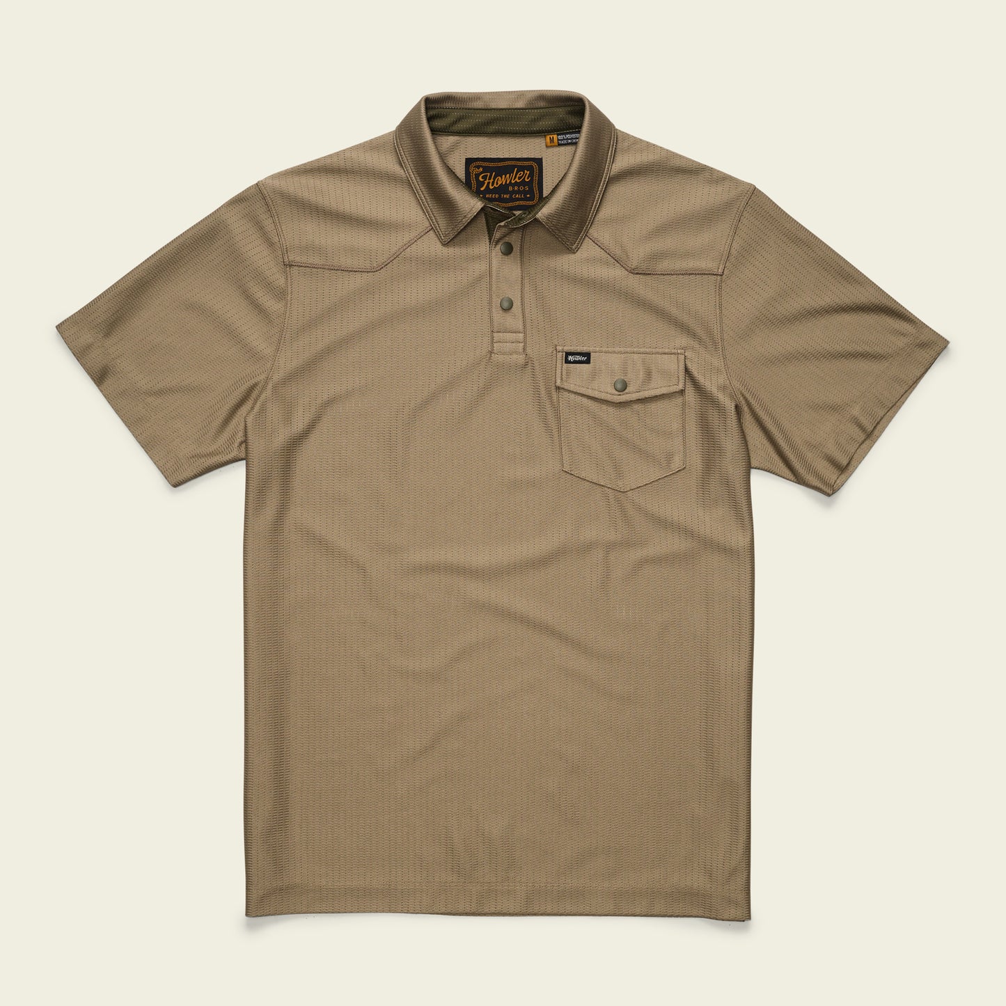 A short-sleeve, khaki-colored tech polo with a collar, three buttons, and a single chest pocket with a button flap. Made from recycled polyester, it features a subtle textured pattern and a small brand tag on the pocket.