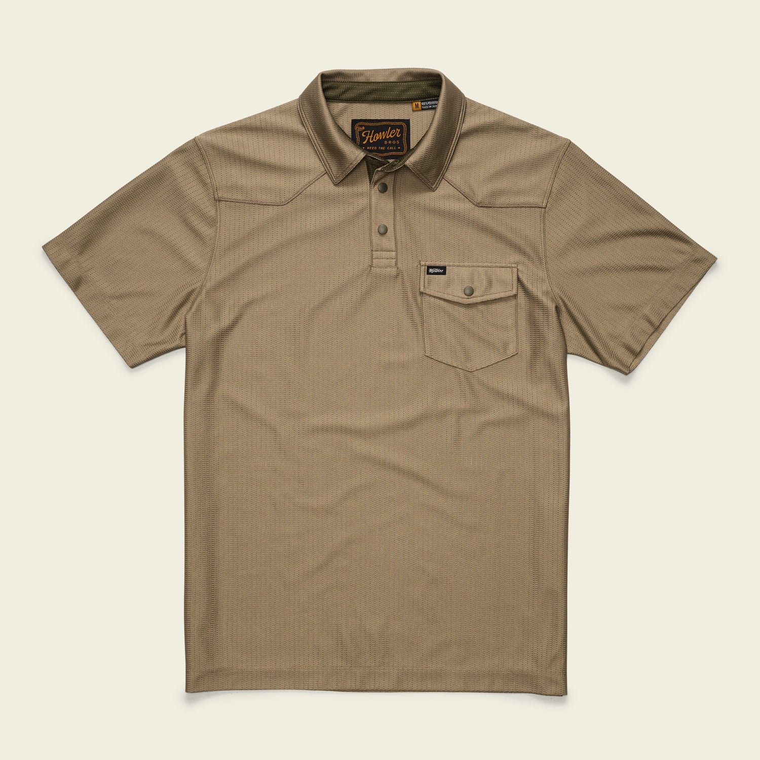 A short-sleeve, khaki-colored tech polo with a collar, three buttons, and a single chest pocket with a button flap. Made from recycled polyester, it features a subtle textured pattern and a small brand tag on the pocket.
