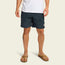 A person wearing a white t-shirt, Pressure Drop Cord Shorts made from stretch cotton corduroy with an elastic waistband, and brown flip-flops stands against a plain light background. Only the lower half of their body is visible.