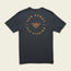Dark gray Howler Select T-Shirt from the JT Van Zandt Collection, featuring orange and yellow text reading Van Zandt Fly Fishing and Texas Coast around a fish hook graphic forming the letter V on the back.