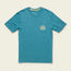 A teal short-sleeve t-shirt from our Howler Select T-Shirts collection, made with a soft cotton-poly blend, features an orange and white Hermano Howler logo above the chest pocket, laid flat on a light background.