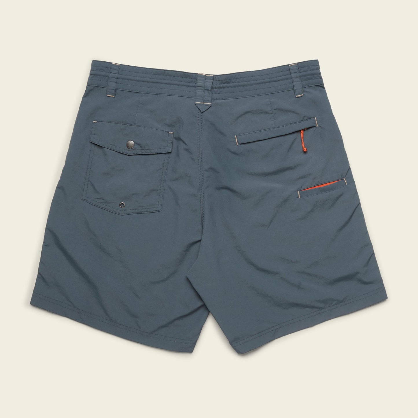 Blue Horizon Hybrid Shorts shown from the back, featuring a flap pocket with button on the left, an open pocket with small orange loop on the right, durable ripstop fabric, and belt loops along the waistband—perfect versatile shorts for any adventure.