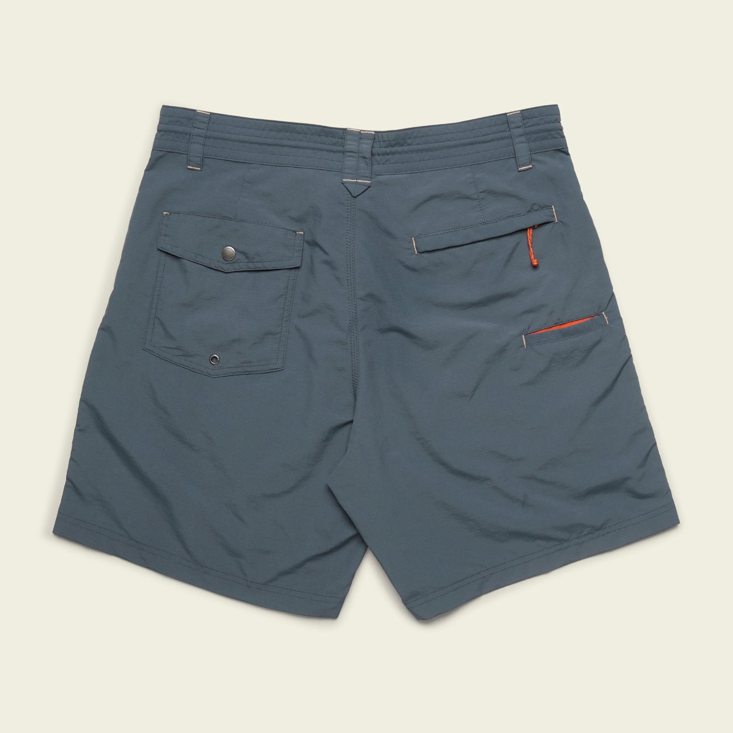 Blue Horizon Hybrid Shorts shown from the back, featuring a flap pocket with button on the left, an open pocket with small orange loop on the right, durable ripstop fabric, and belt loops along the waistband—perfect versatile shorts for any adventure.