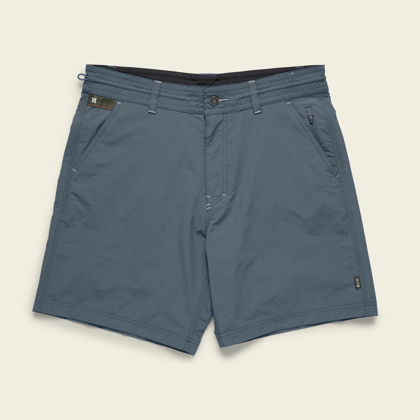 Blue-gray Horizon Hybrid Shorts for men, crafted from durable ripstop fabric with front and side pockets, belt loops, a button and zip closure, and subtle stitching details, laid flat on a light background.