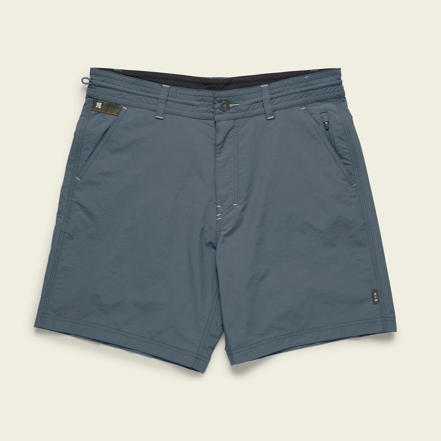 Blue-gray Horizon Hybrid Shorts for men, crafted from durable ripstop fabric with front and side pockets, belt loops, a button and zip closure, and subtle stitching details, laid flat on a light background.