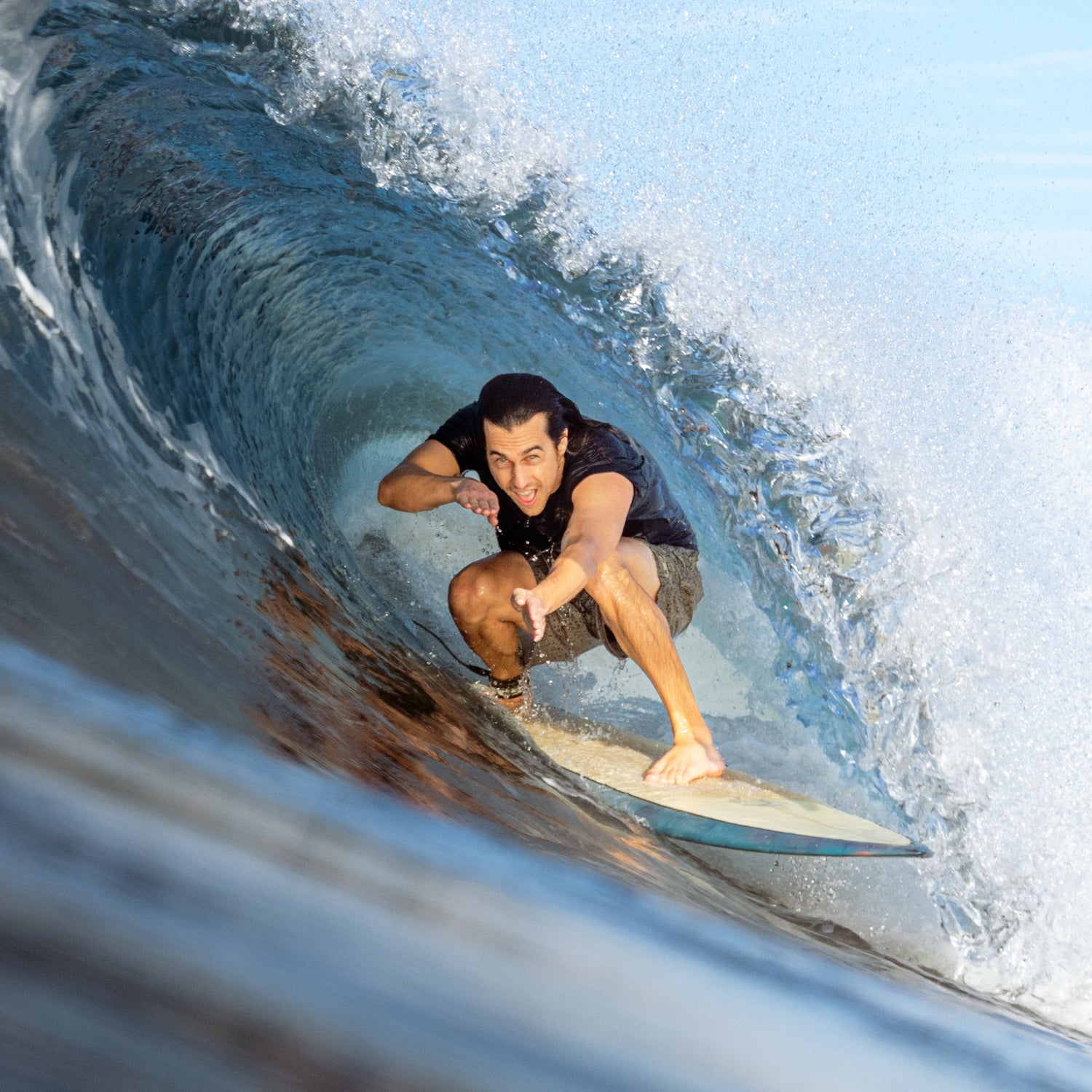 Man riding wave in curl. 