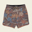 A pair of Bruja Boardshorts in brown with a colorful floral pattern in blue, orange, and beige tones, featuring a drawstring waistband, draining front pockets, stretchy fabric, and a Howler patch near the bottom hem.