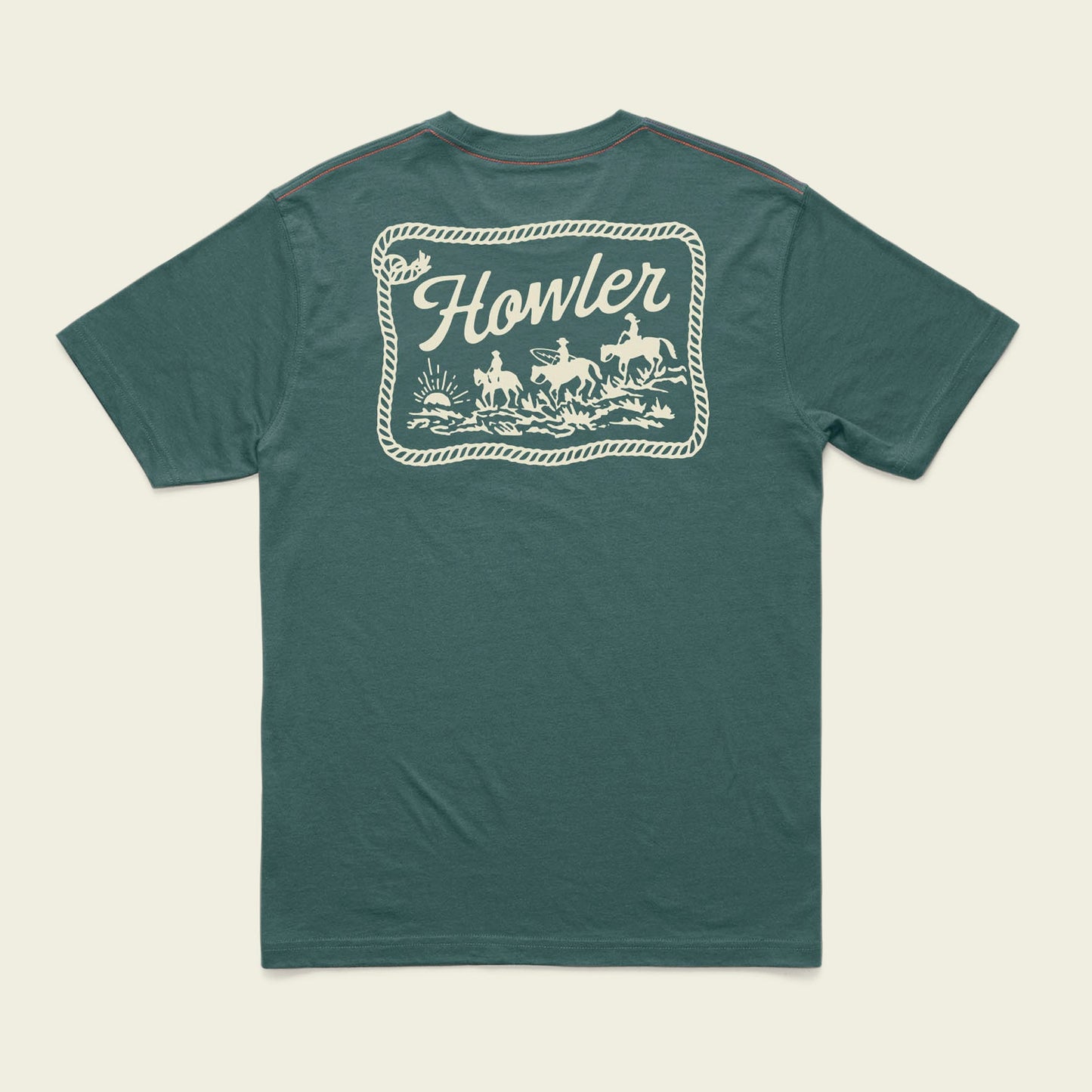 Green short-sleeve t-shirt with a large cream-colored graphic on the back. Crafted from a cotton-poly blend for maximum comfort, this Howler blended t-shirt features “Howler” above three horseback riders framed by a rope border.