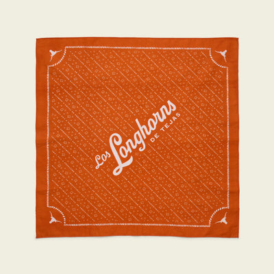 Burnt orange square bandana with white decorative patterns, corners featuring small longhorn symbols, and “Los Longhorns de Tejas” written diagonally—an ideal game day accessory for University of Texas Longhorns fans.
